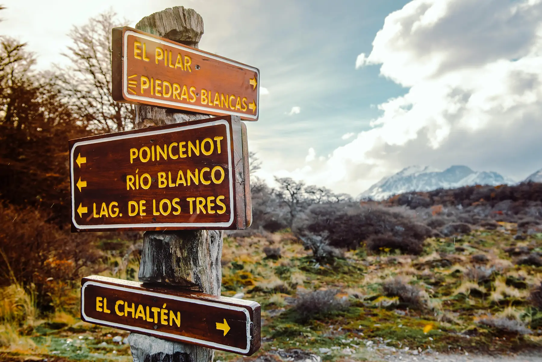The colourful buildings of El Chalten against a mountain backdrop.