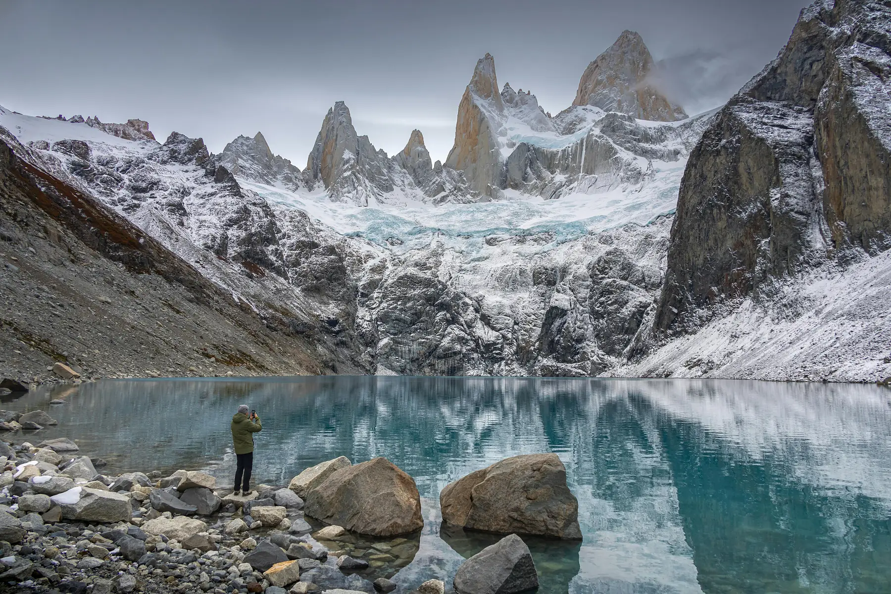 A mountain refugio in Patagonia surrounded by forest and mountain peaks