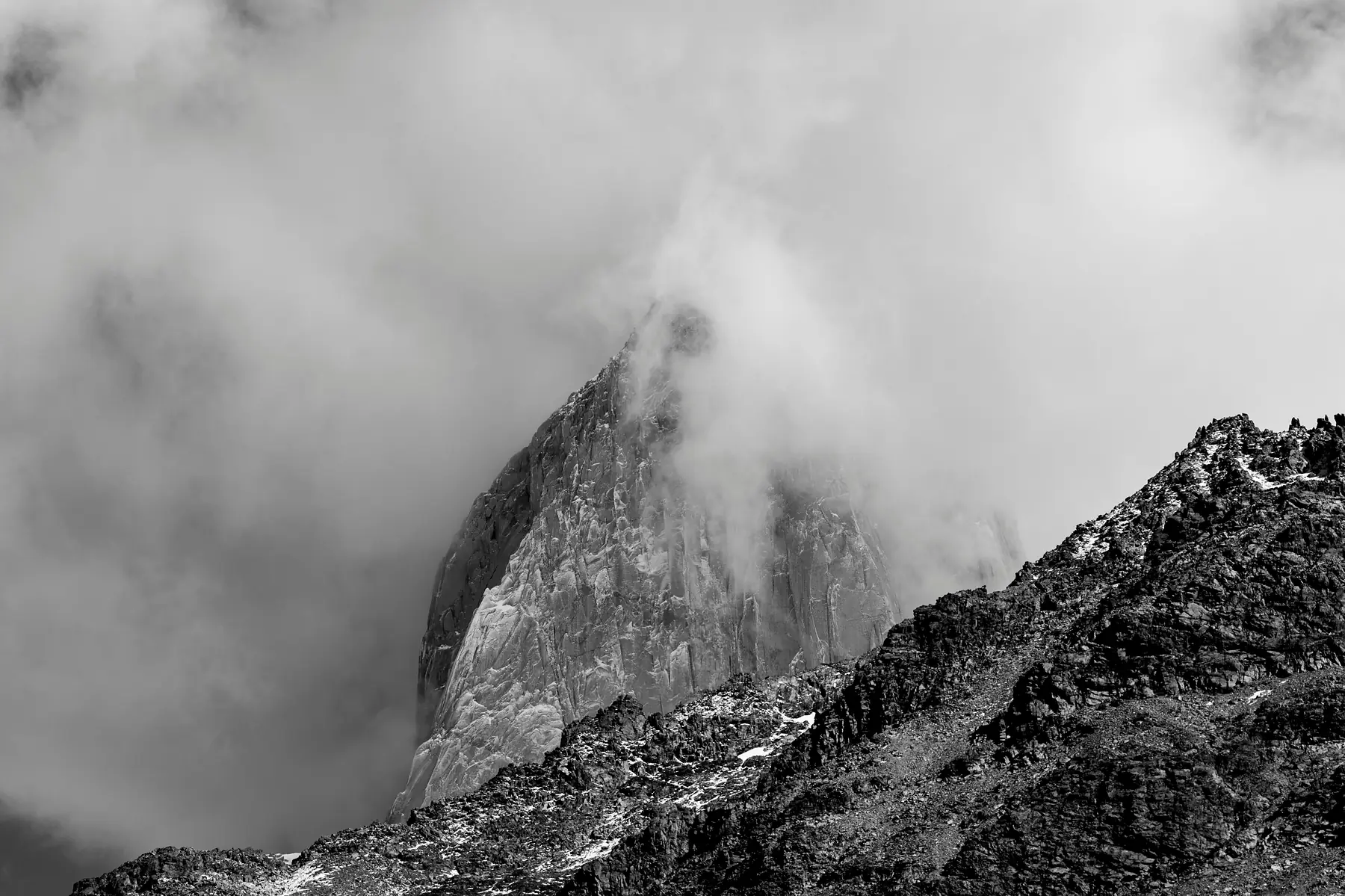 The jagged granite needles of the Fitz Roy massif in clear skies.