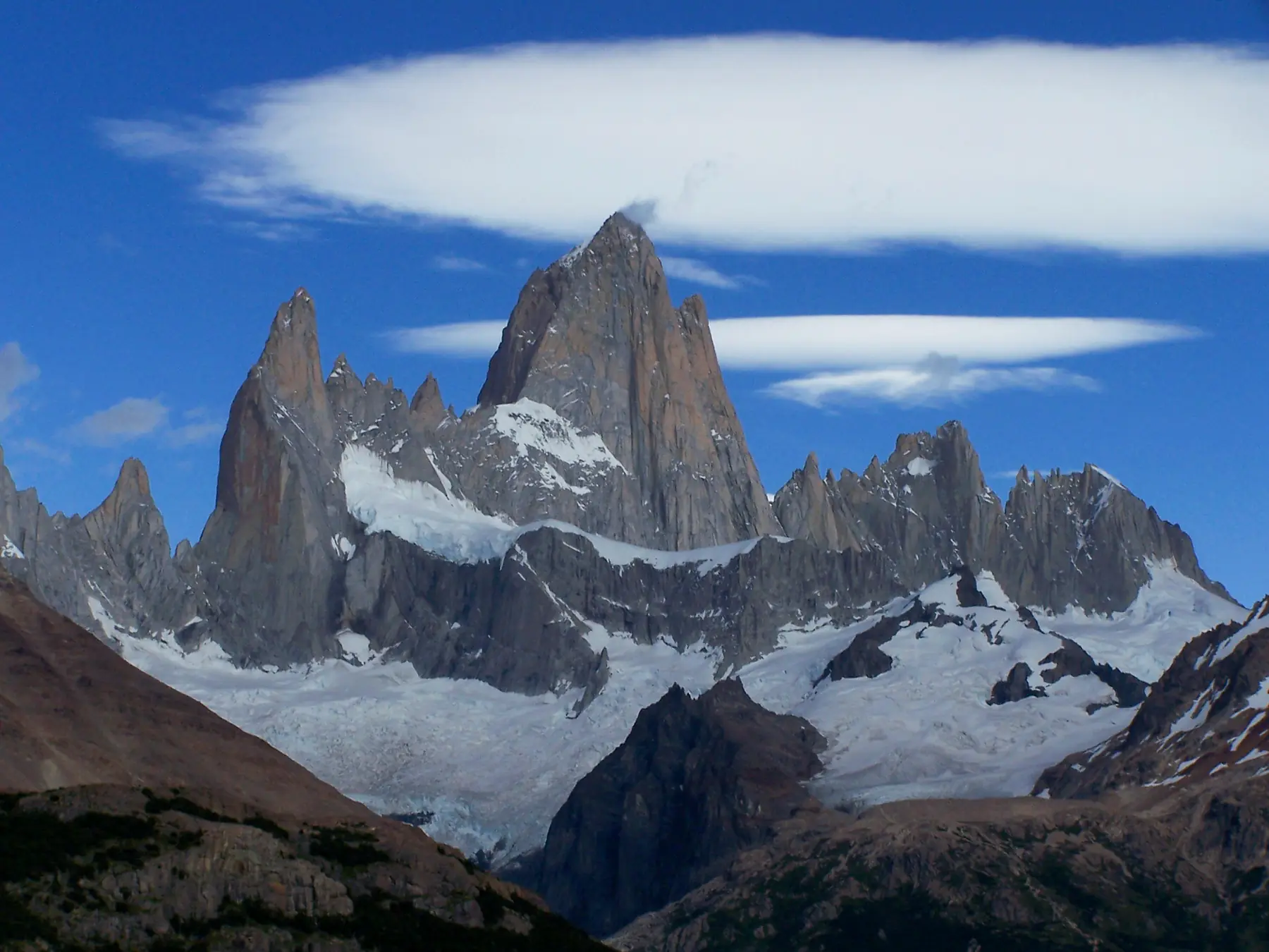 Mount Fitz Roy catching the first light of dawn above El Chalten.