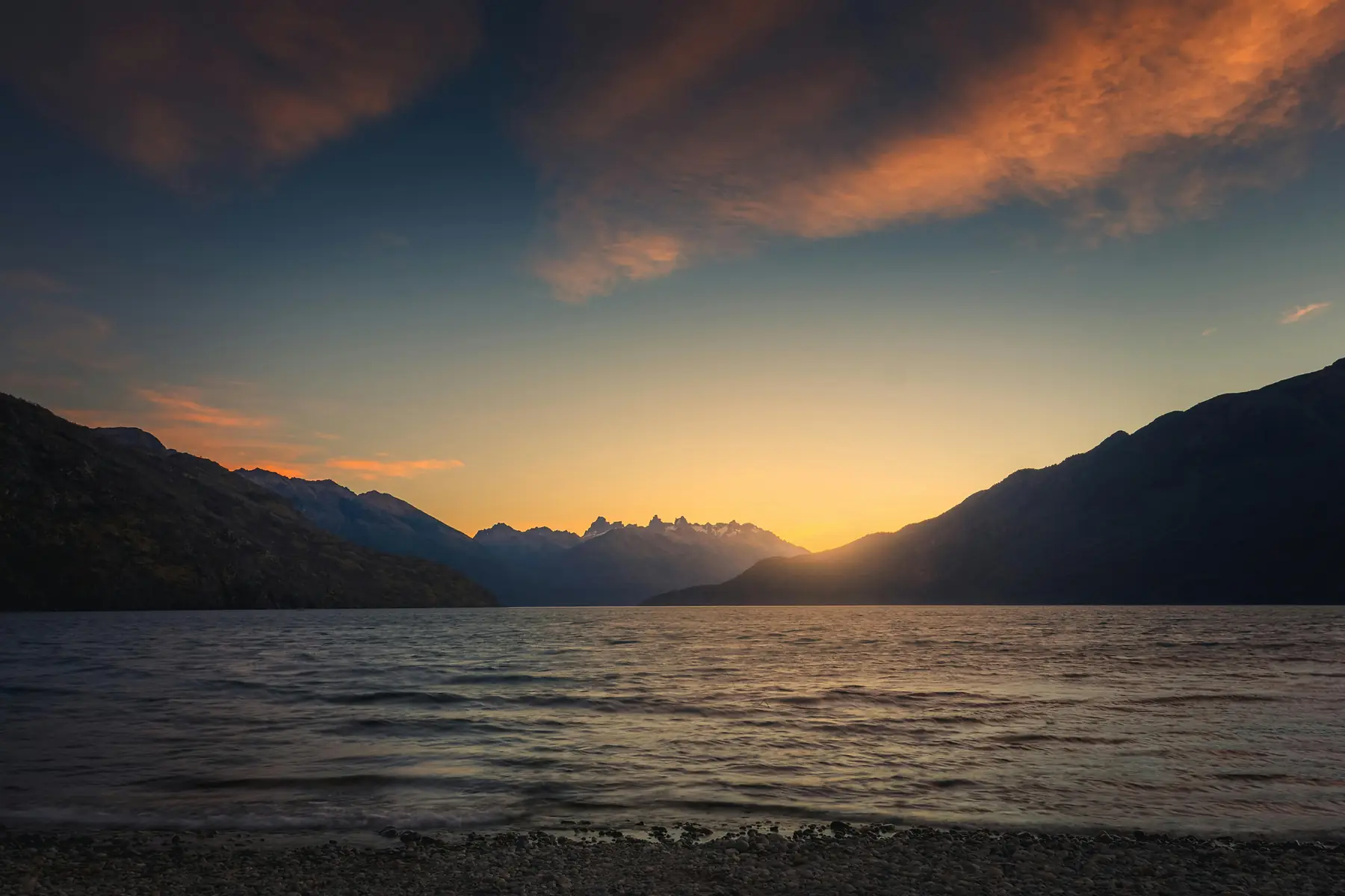 A sweeping Patagonian landscape under dramatic cloud formations.