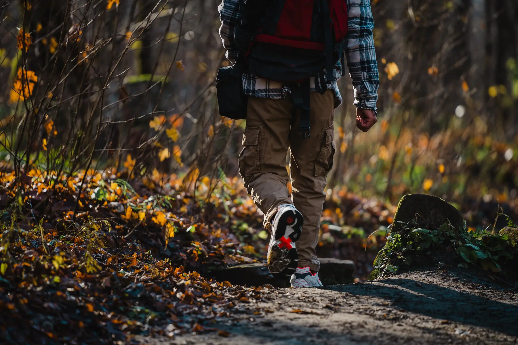 Quick-dry trekking pants paired with gaiters on a muddy Patagonian trail