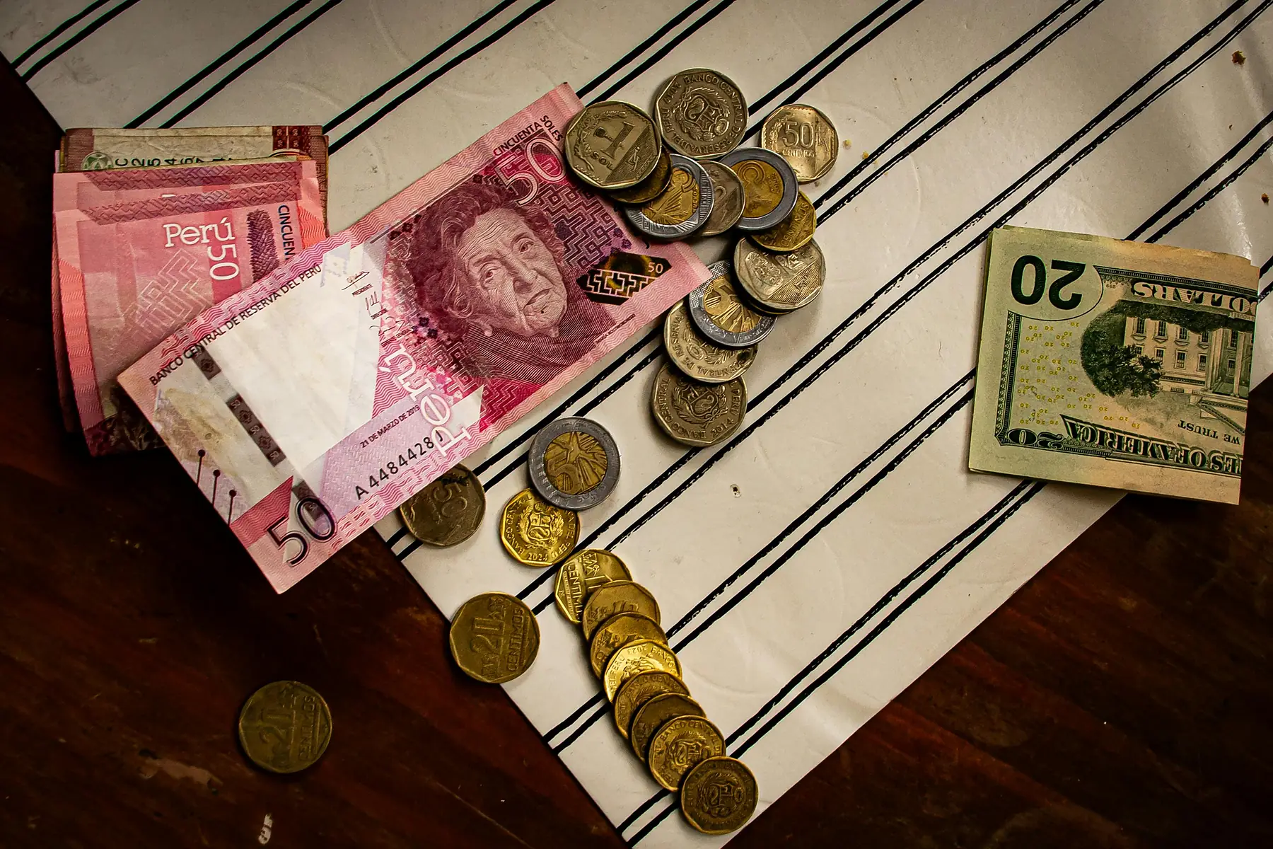A traveler withdrawing Argentine pesos from an ATM in El Calafate.