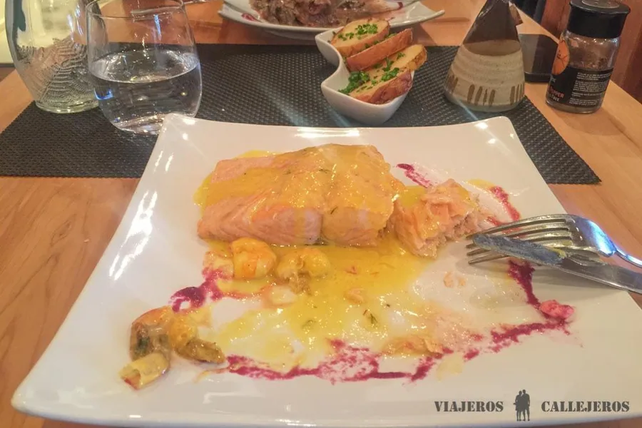 Patagonian meat served with colorful accompaniments