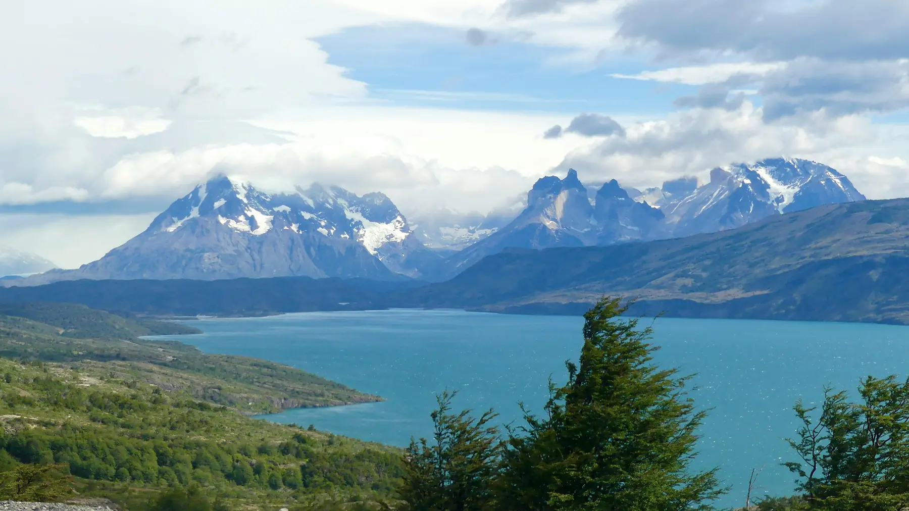 Dramatic Patagonian sky with fast-moving clouds over the steppe and distant mountains